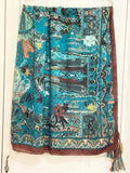 Scarf by Tiger Tree. Jacquard design on teal